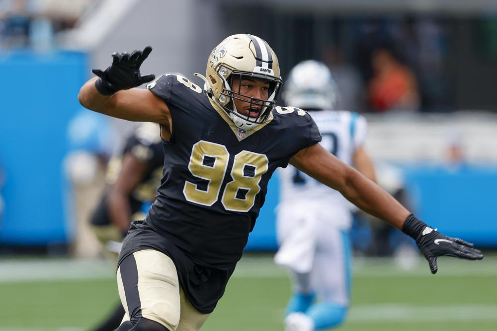 FILE - New Orleans Saints defensive end Payton Turner moves against the Carolina Panthers during the second half of an NFL football game Sunday, Sept. 19, 2021, in Charlotte, N.C. Saints 2021 first-round draft choice Turner says he still feels a bit like a rookie with a lot to prove after injuries largely derailed his maiden NFL campaign. (AP Photo/Nell Redmond, File)